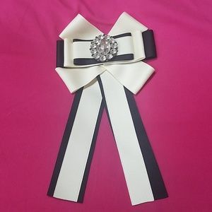 Cream and black embellished bow brooch